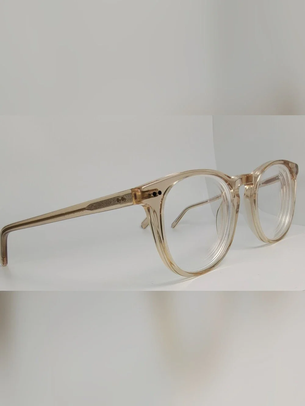 Ona. RFLKT. Clear Beige Round Frame Glasses.